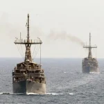 Which countries will send warships through the Strait of Hormuz by April 30?