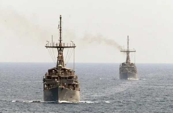 Which countries will send warships through the Strait of Hormuz by April 30?